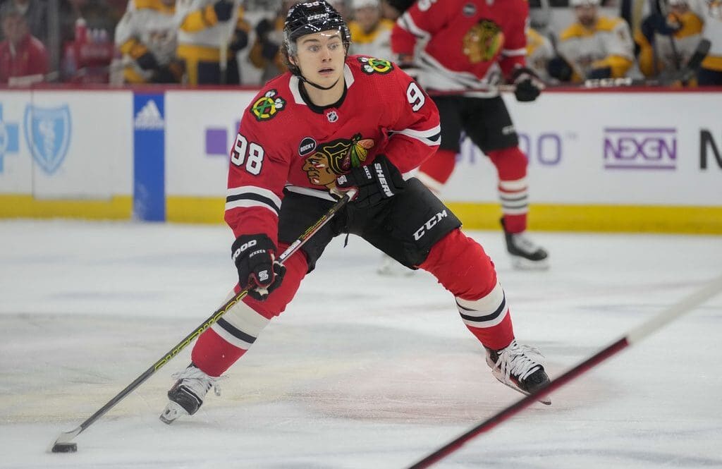 Chicago Blackhawks center Connor Bedard handles the puck during the second period an NHL hockey game against the Nashville Predators Tuesday, Dec. 5, 2023, in Chicago. (AP Photo/Erin Hooley)