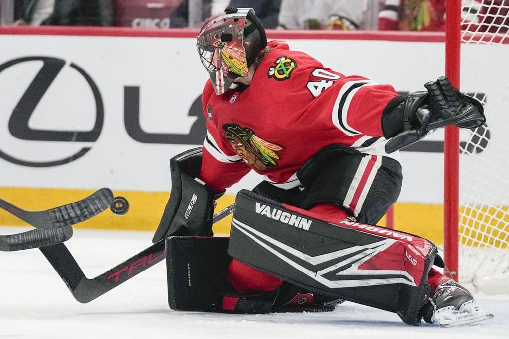 Chicago Blackhawks goaltender Arvid Soderblom deflects a shot during the first period an NHL hockey game against the Nashville Predators, Tuesday, Dec. 5, 2023, in Chicago. (AP Photo/Erin Hooley)