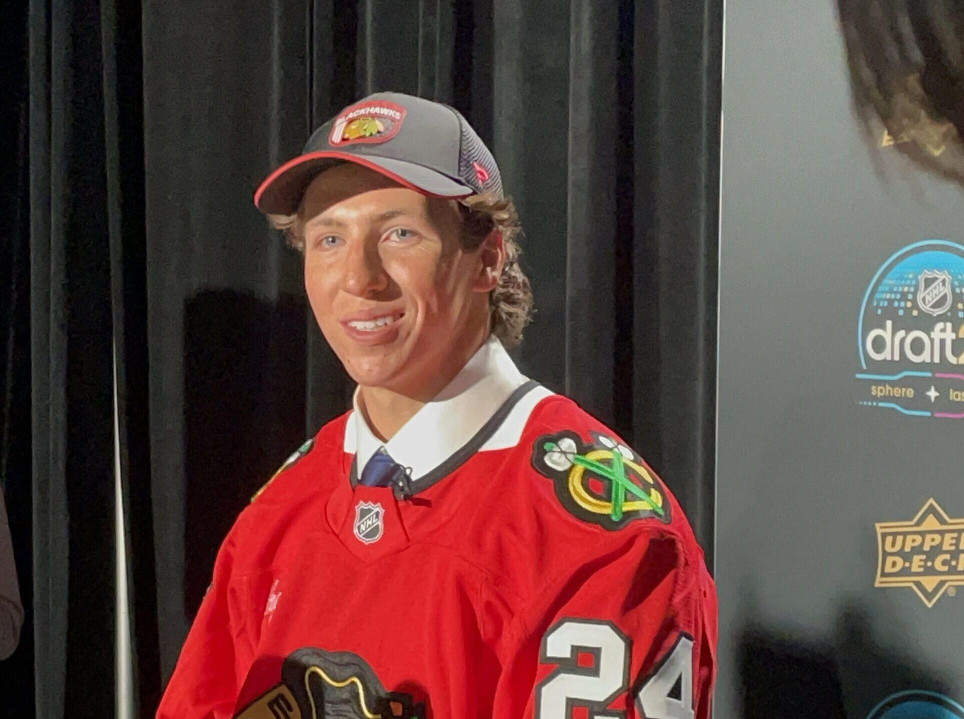AJ Spellacy addresses the media after being drafted by the Chicago Blackhawks at the 2024 NHL Draft.