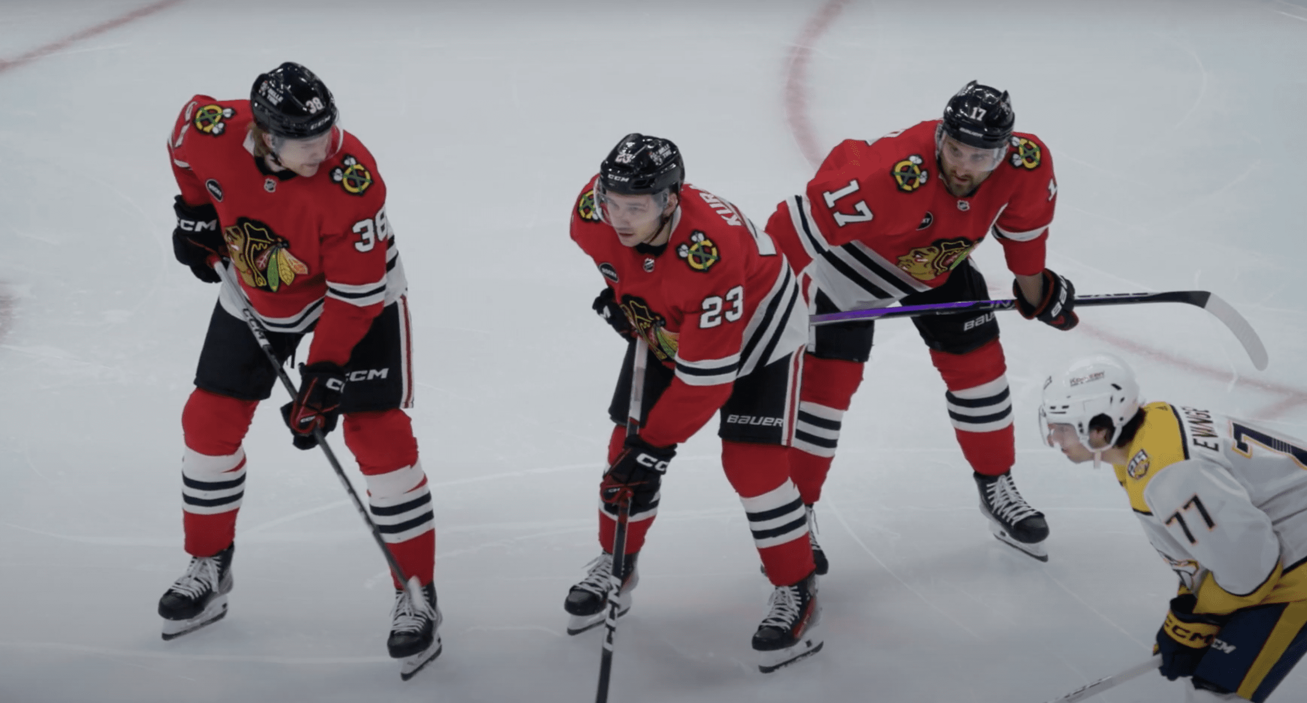 Ethan Del Mastro, #38, Philipp Kurashev #23 and Nick Foligno #17 await the faceoff in the defensive zone against the Nashville Predators.