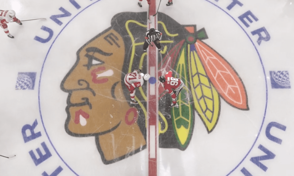 Chicago Blackhawks forward Connor Bedard and Dylan Larkin of the Detroit Red Wings get ready for the faceoff to start the preseason game on Sept. 25.