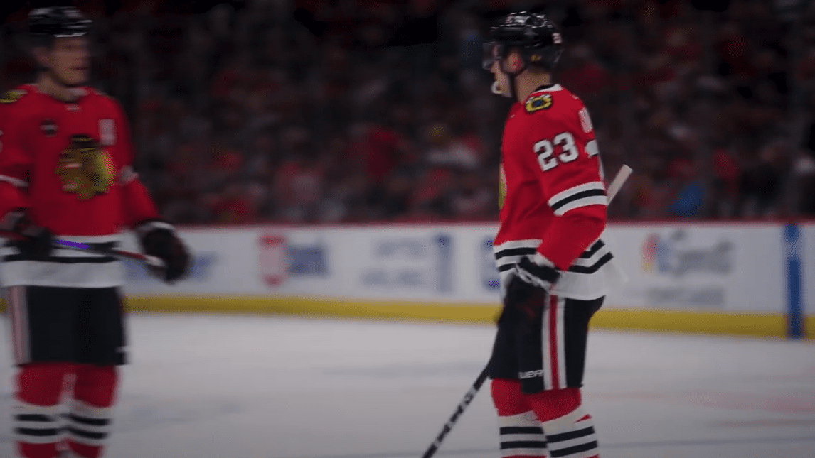 Philipp Kurashev and Connor Murphy communicate during a Blackhawks/Predators game late in the 2023-24 NHL Season.