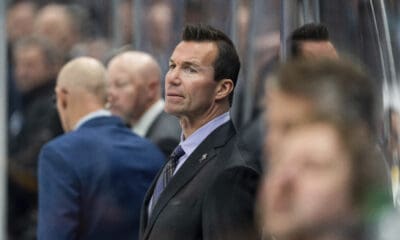 Chicago Blackhawks head coach Luke Richardson watches from the bench during the third period of an NHL hockey game against the Utah Hockey Club, Tuesday, Oct. 8, 2024, in Salt Lake City. (AP Photo/Spenser Heaps)